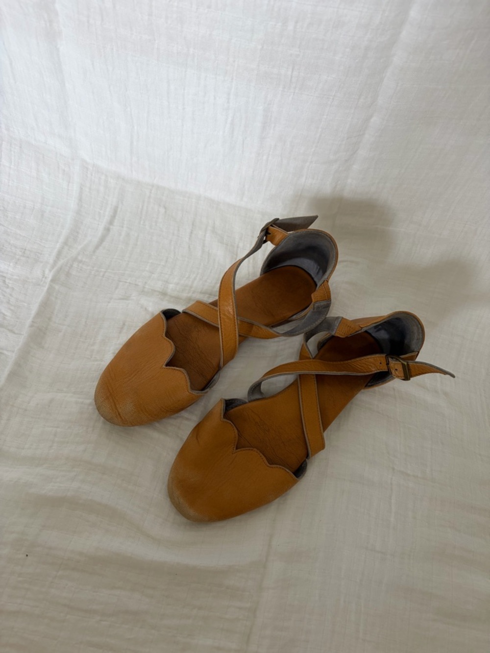 Women’s Scalloped Tan Leather Cross-Strap Flats